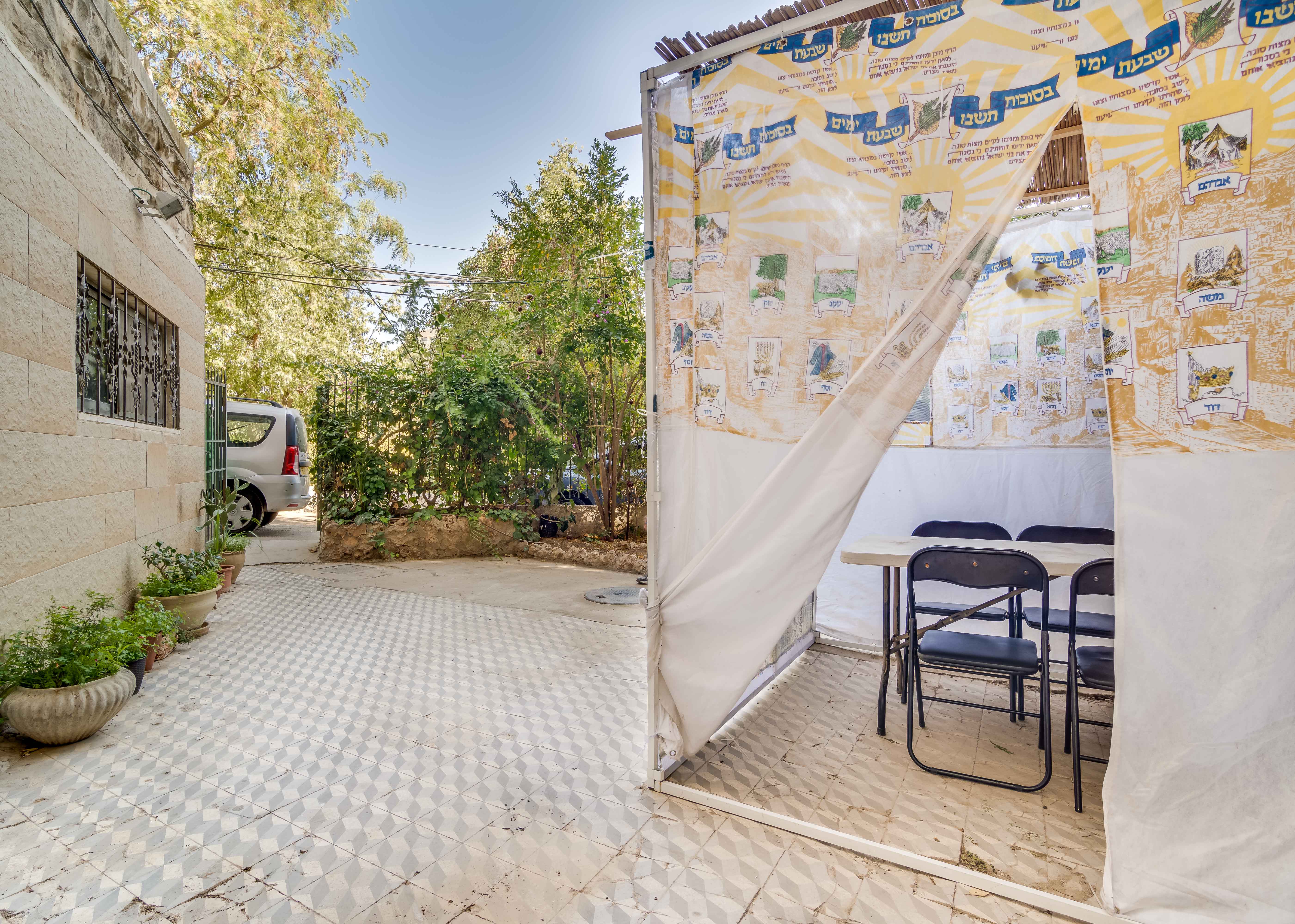 Sukkah in Courtyard of Building Sukkah in Courtyard of Building